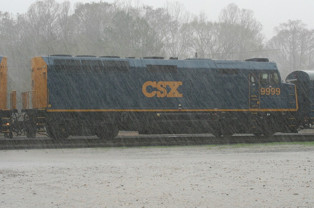 CSX Business train in pouring rain